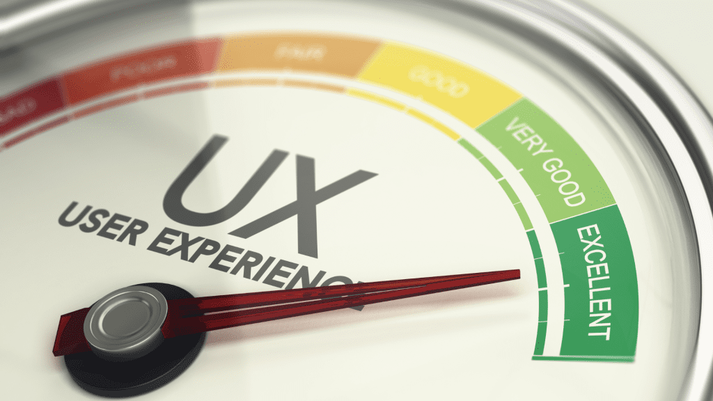 A close-up of a gauge measuring "UX User Experience," with the needle pointing to "Excellent."